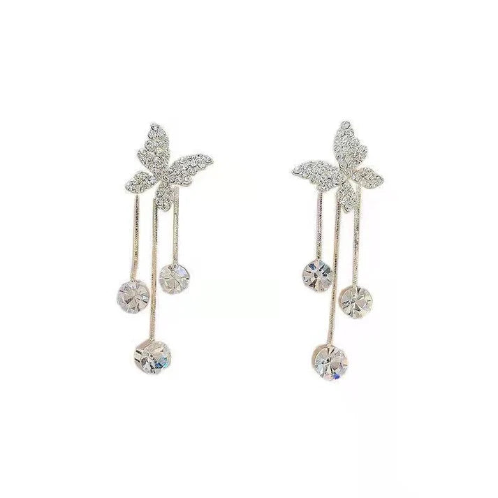 Shiny butterfly rhinestone earrings with pearl tassel, elegant, long dangle.